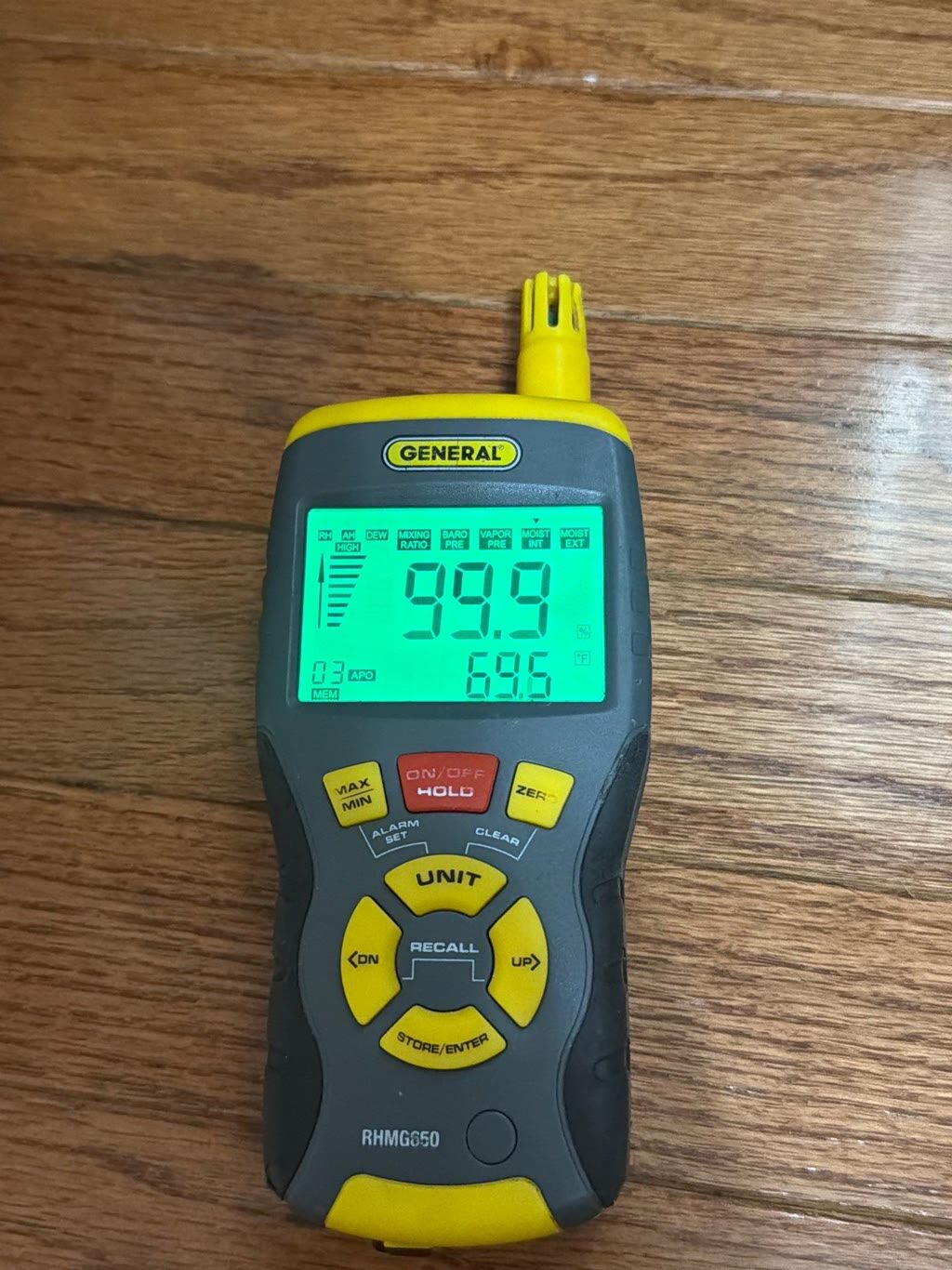 moisture meter reading near 100 percent on saturated hardwood, Woodbridge, VA