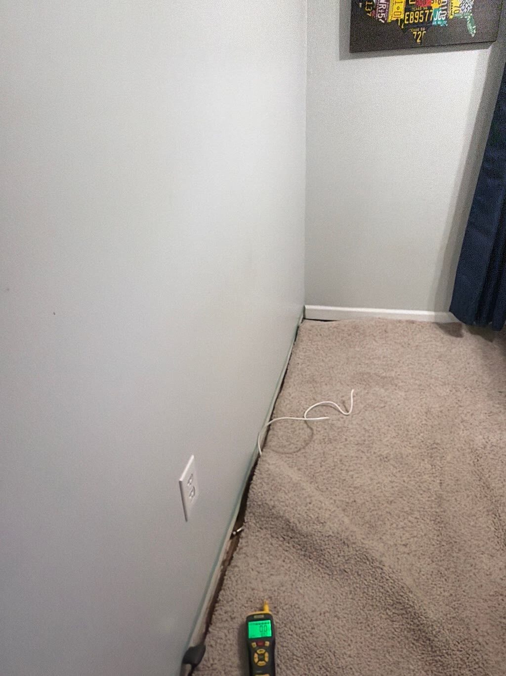 moisture meter confirming zero reading after structural drying, Woodbridge, VA