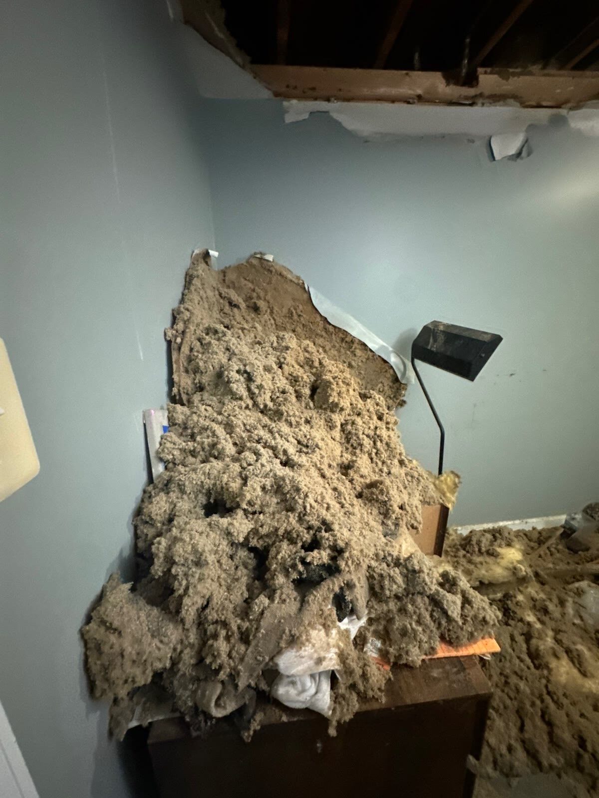 Water-saturated ceiling collapsed with fallen insulation, Woodbridge VA