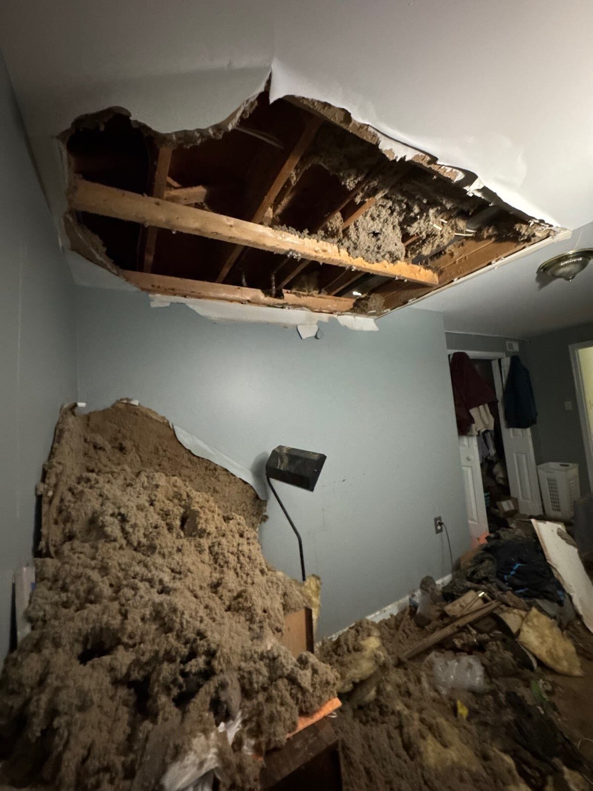 Soaked drywall and insulation removed from failed ceiling, Woodbridge VA
