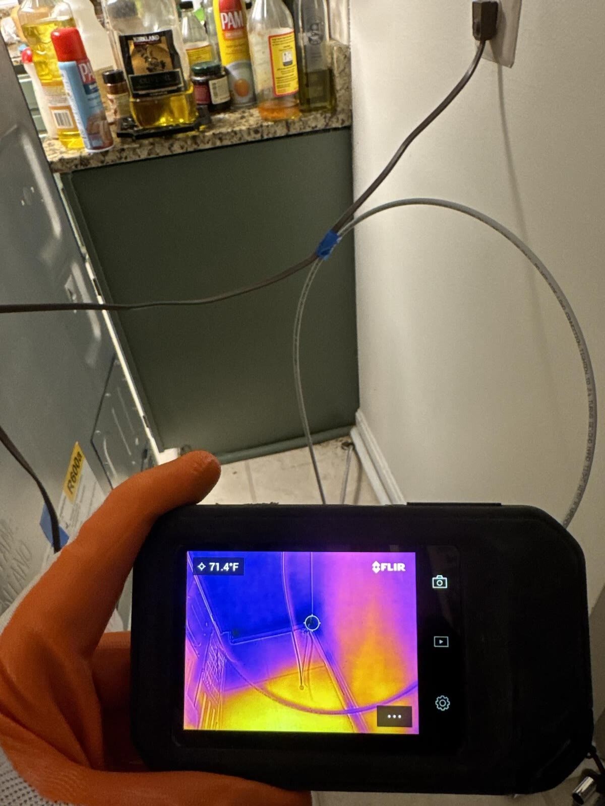 Thermal imaging camera tracing hidden moisture in the kitchen, Woodbridge VA
