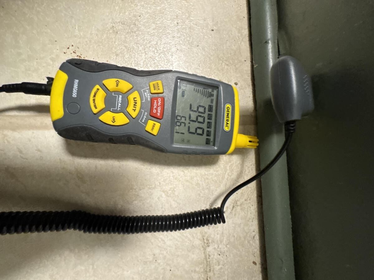 Moisture meter reading near full saturation during inspection, Woodbridge VA