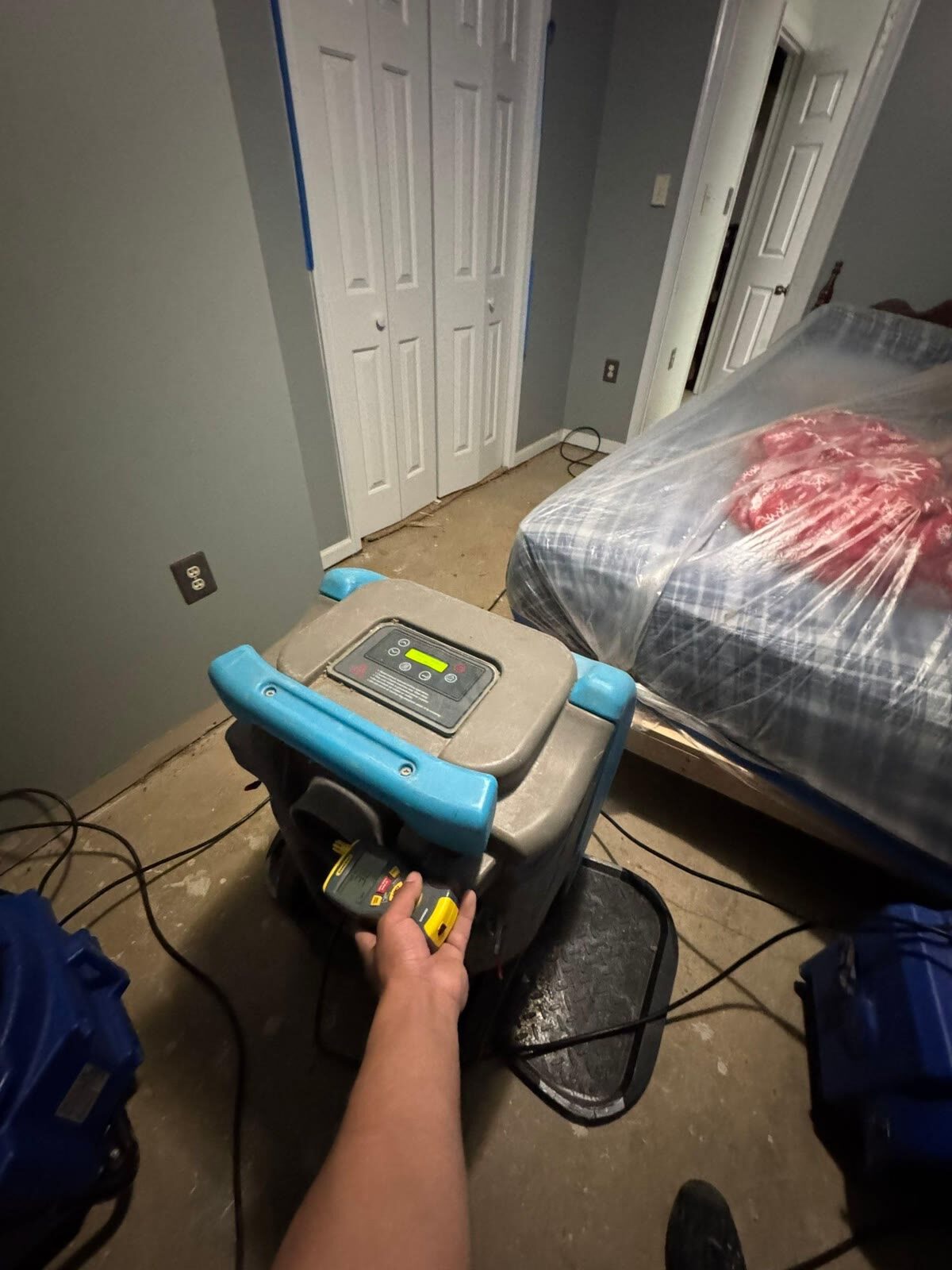 Water extraction and drying equipment running in an affected bedroom, Woodbridge VA