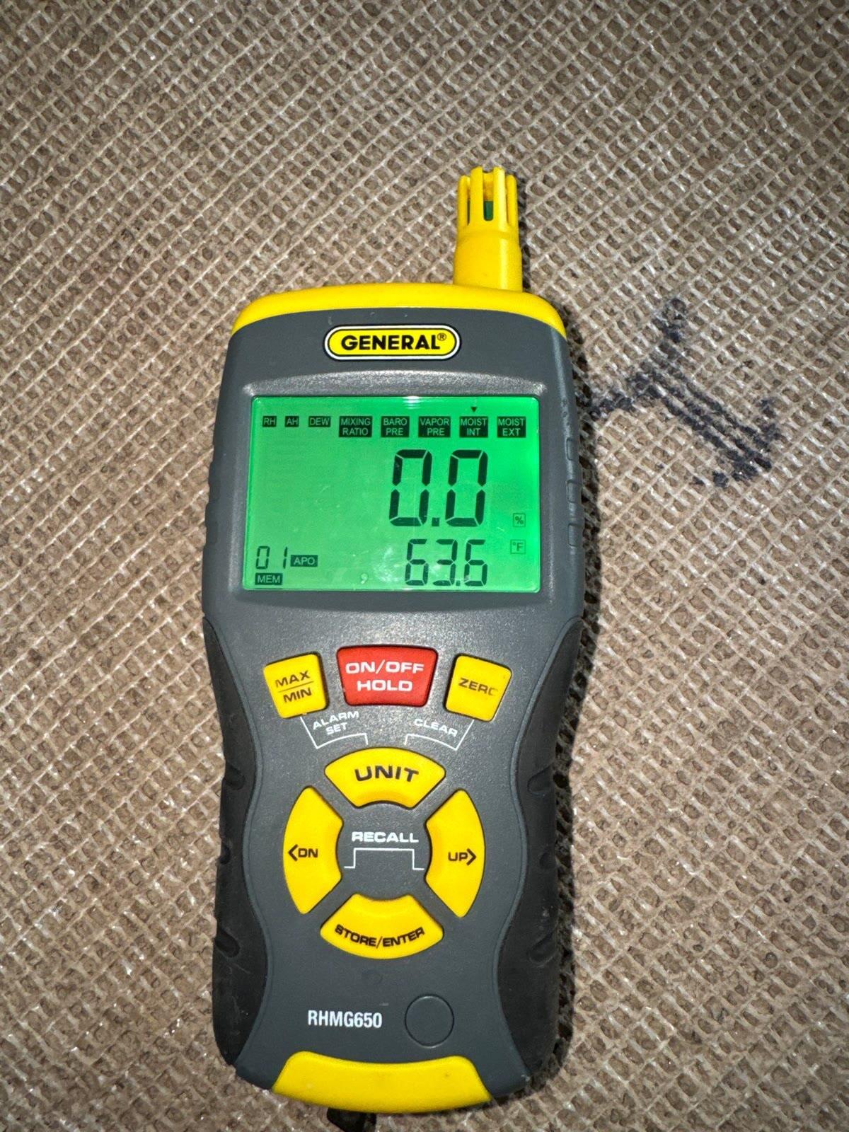 Moisture meter verifying materials dried to standard at 0.0, Woodbridge VA