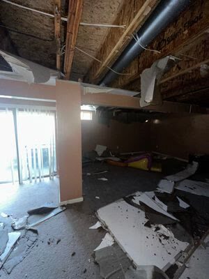 collapsed ceiling and water-damaged debris, Manassas VA