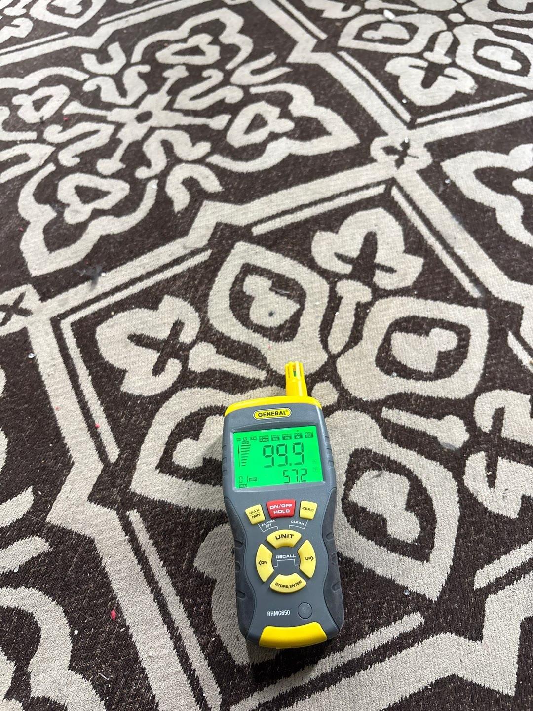 moisture meter confirming saturated flooring, Manassas VA