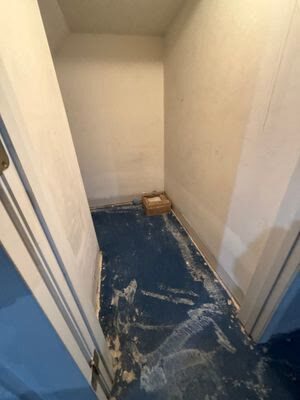 closet with carpet and baseboard removed exposing the subfloor for drying, Woodbridge VA