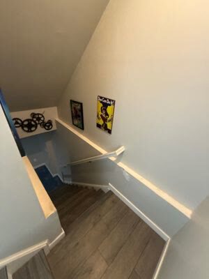 wood-look plank flooring at the top landing of a basement staircase, Woodbridge VA